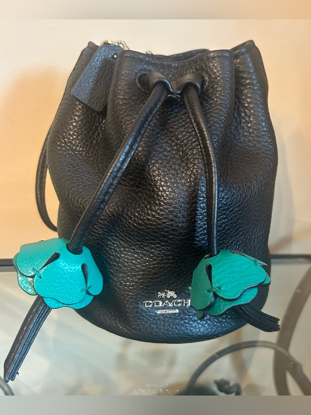 Coach Black Pebbled Leather Mini Drawstring Bag with Teal Floral Charms